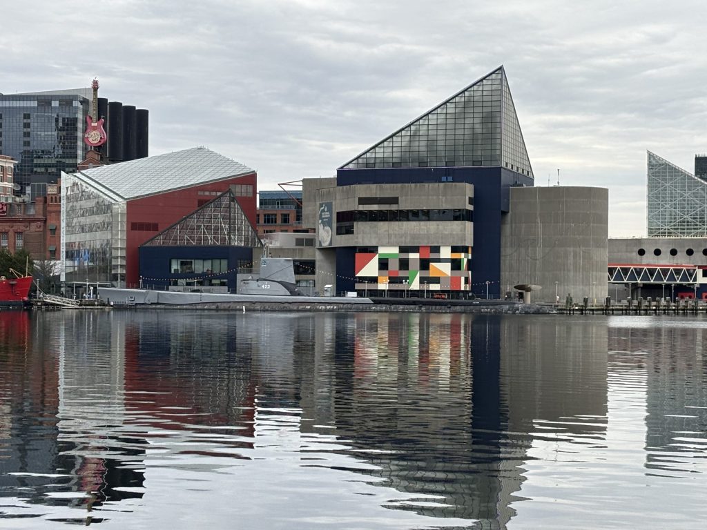 Photo of Baltimore's Inner Harbor - building on the side of a waterfront pier.